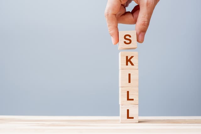 640-hand-holding-wooden-block-with-skill-word