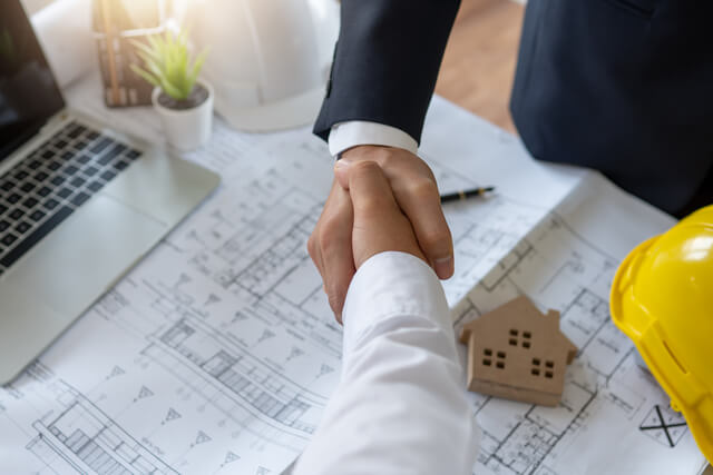 640-engineer-and-finance-investor-shaking-hands