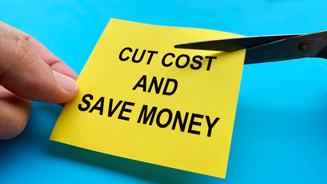 640-scissors-that-cut-yellow-notepad-with-cut-cost-and-save-money-text-on-blue-background-spending-concept